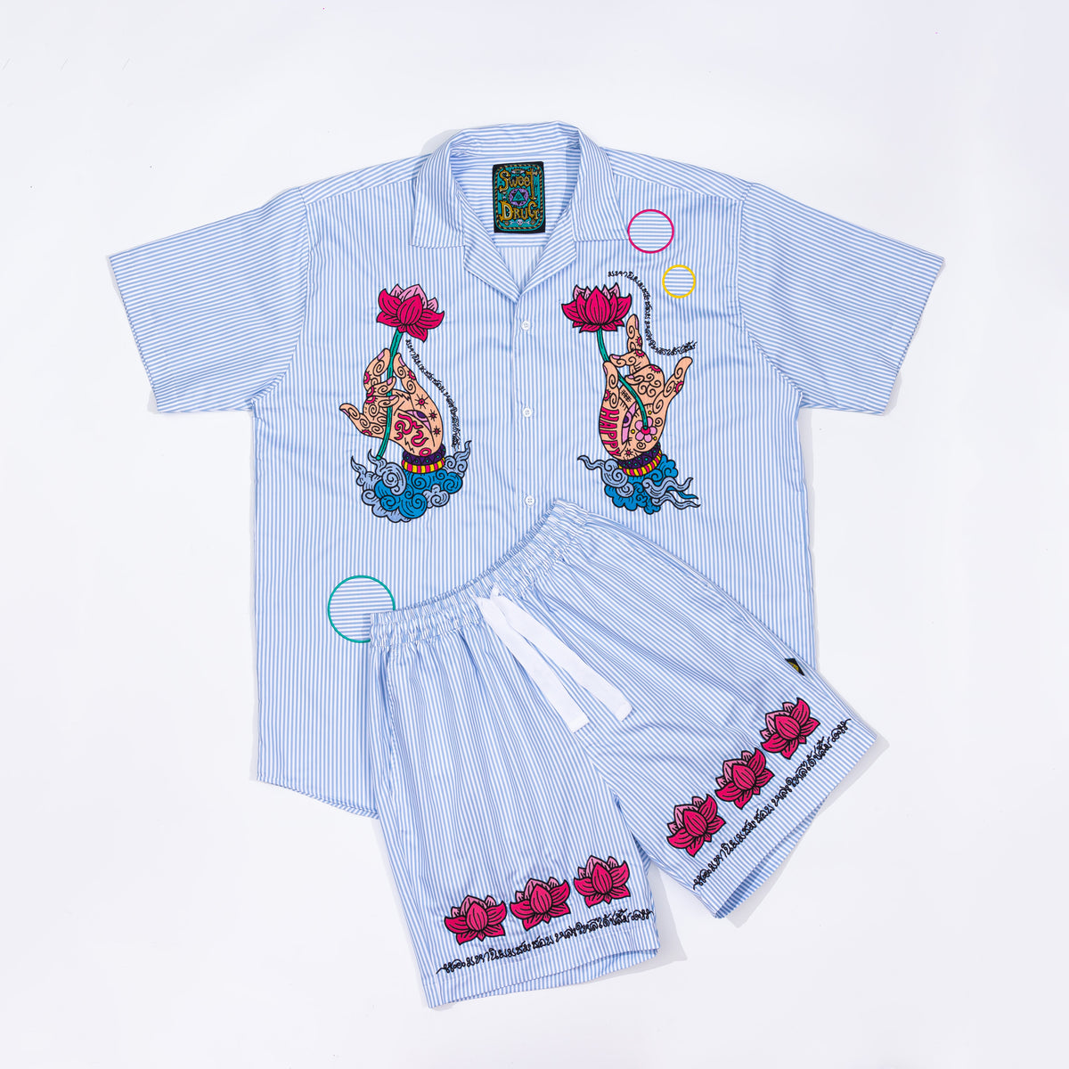 Shorts in striped cotton with lotus pattern embroidery