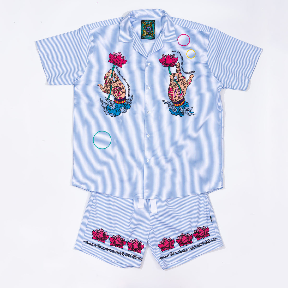 Shorts in striped cotton with lotus pattern embroidery